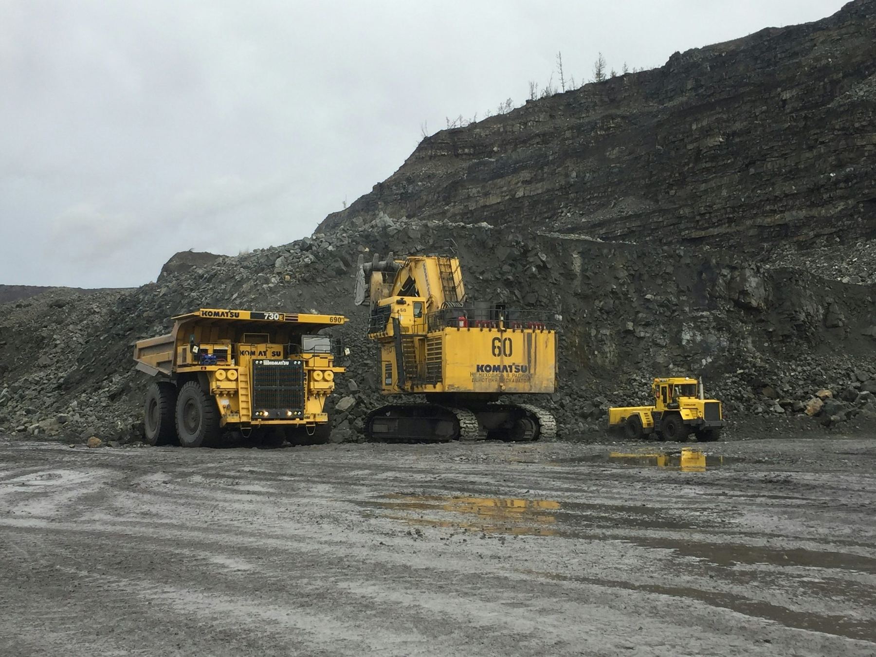 Haul trucks and shovel at an open-pit mine